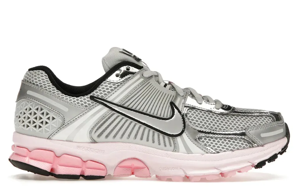 Nike Zoom Vomero 5 Photon Dust Pink Foam (Women's) running in a tropical area