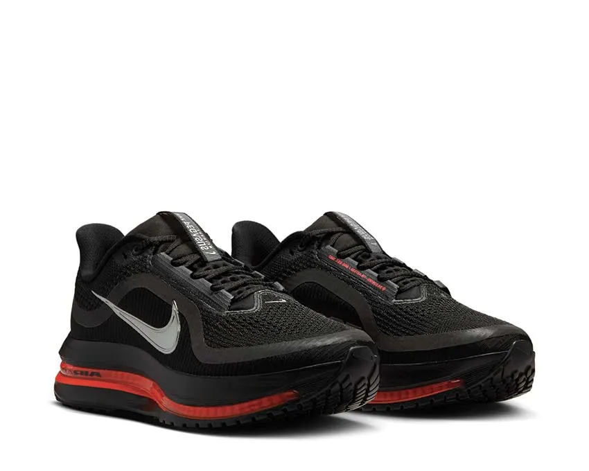 Nike Pegasus Premium W "Black Crimson" running on a grass track shoes