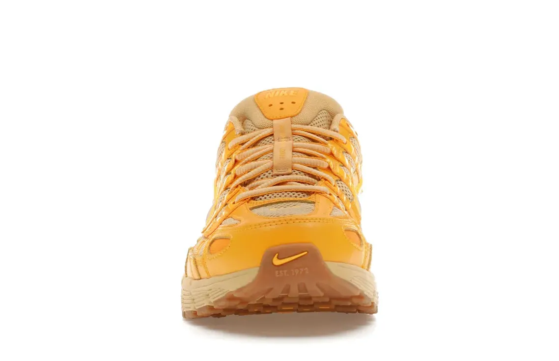 Nike P-6000 University Gold male athlete shoes running in a plateau shoes