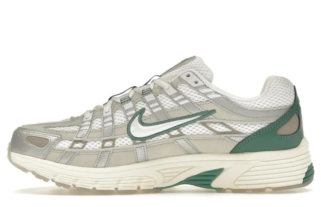 Nike P-6000 Premium Light Bone Bicoastal Green running in a channel area shoes