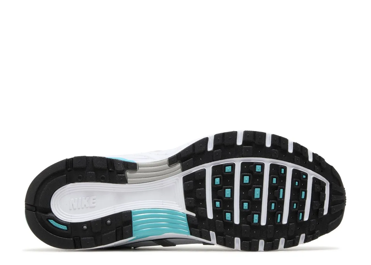 Nike P-6000 Dusty Cactus running in a sports complex shoes