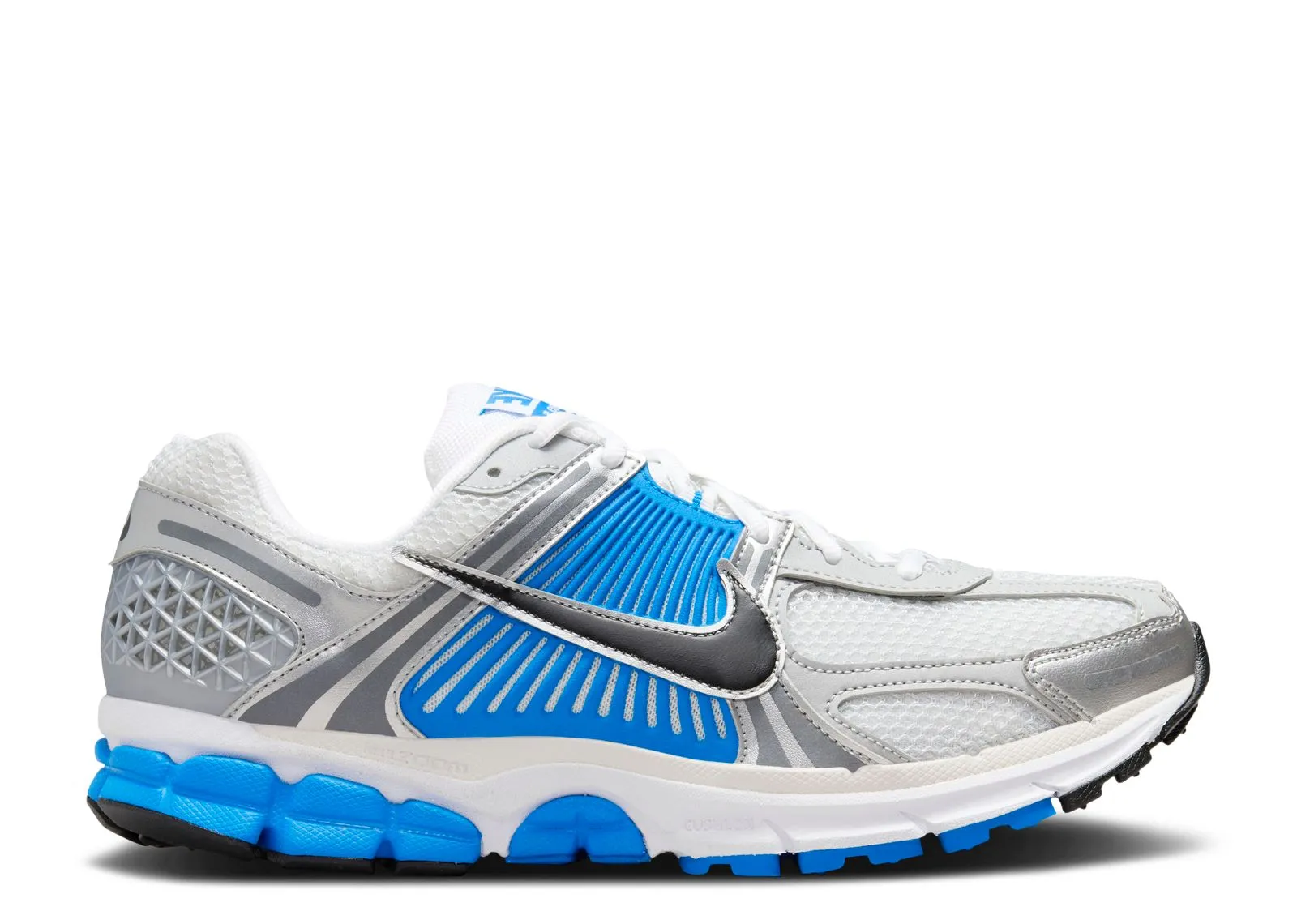 Nike Zoom Vomero 5 Photo Blue running in a marina area shoes