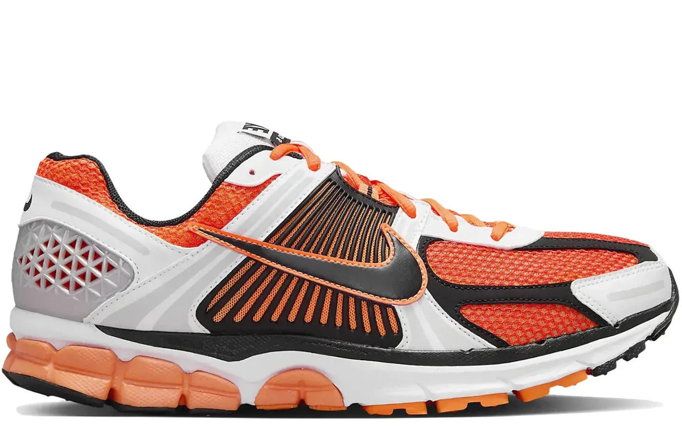 Nike Zoom Vomero 5 Total Orange running in a nature reserve Training